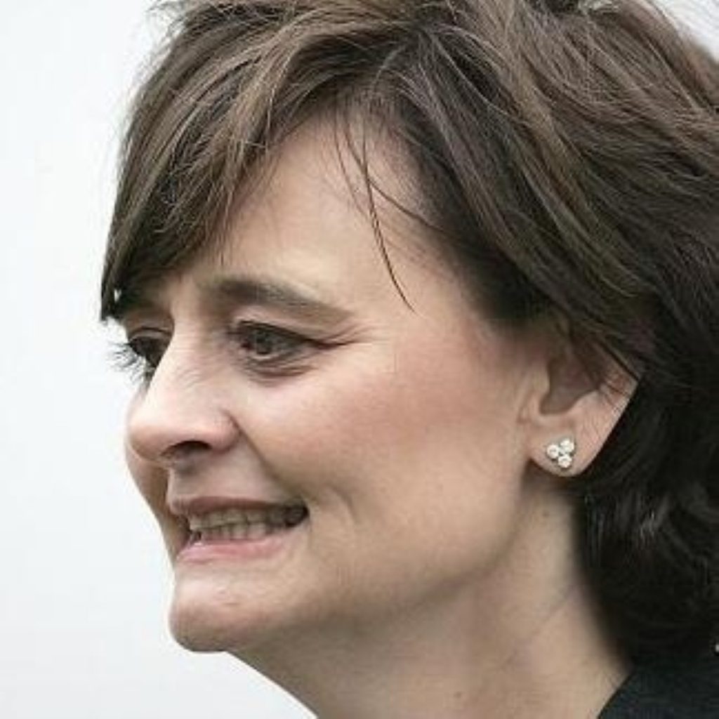 Cherie Blair playfully tapped a teenager after he made a "rabbit ears" gesture