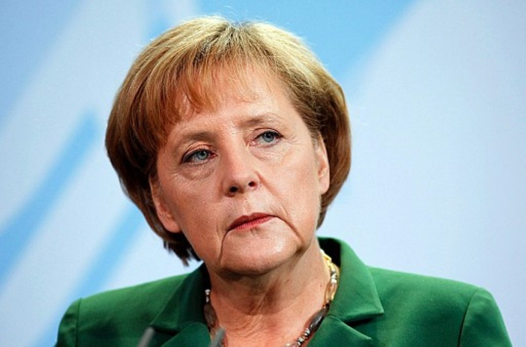 Unimpressed: Merkel was watching Wagner when the naked drug taker boarded her plane.