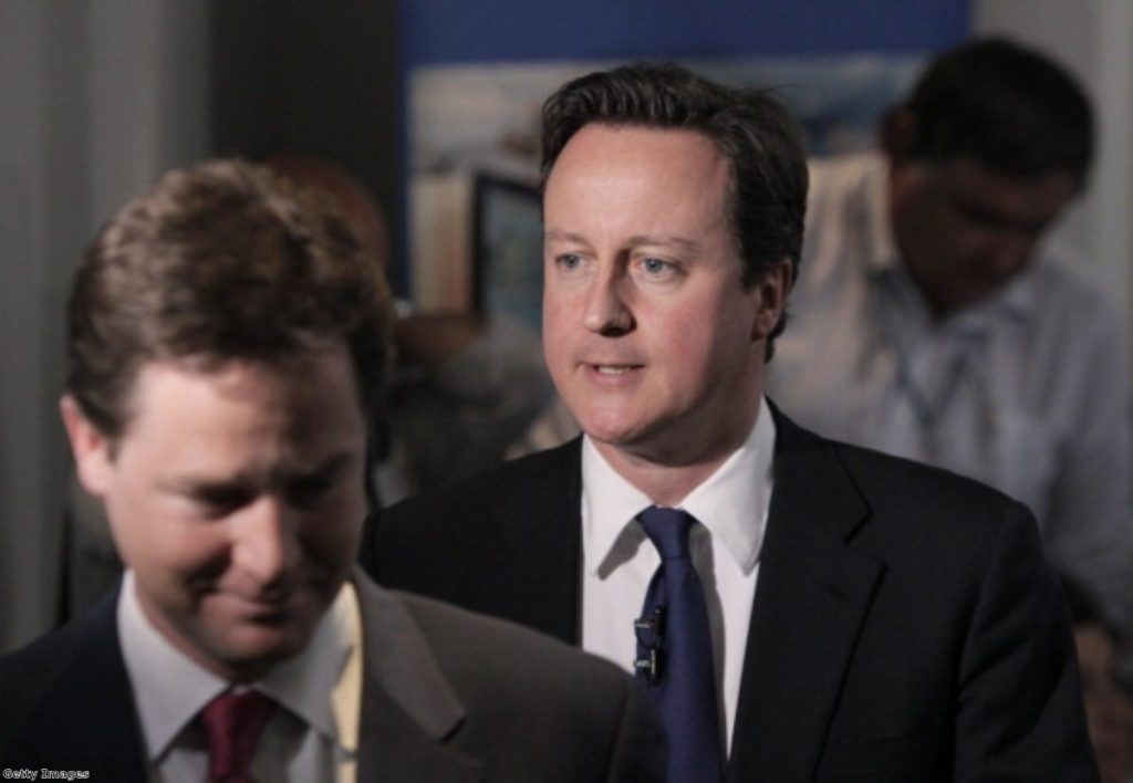 David Cameron and Nick Clegg speak with NHS staff in Surrey
