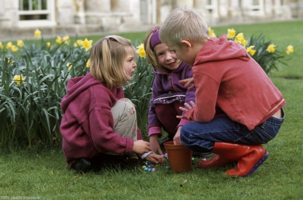 Children play during a National Trust Easter egg hunt. The charity is angry at being branded left-wing by a minister.