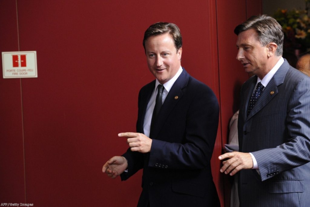 Cameron walks with Slovenian prime minister Borut Pahor during his visit