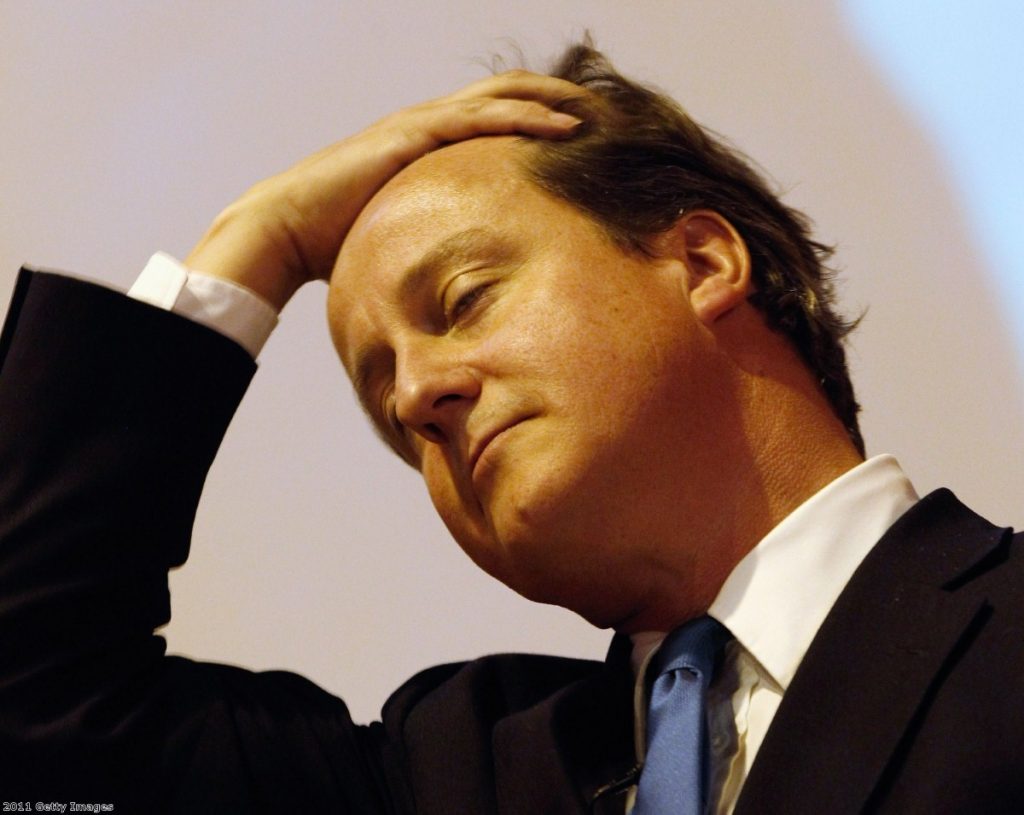 Under pressure: The phone-hacking scandal is threatening Cameron's reputation.