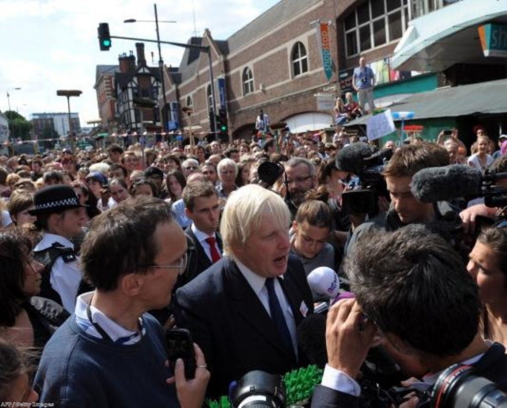 The Mayor is swamped by reporters and Londoners when he returned to the city yesterday.