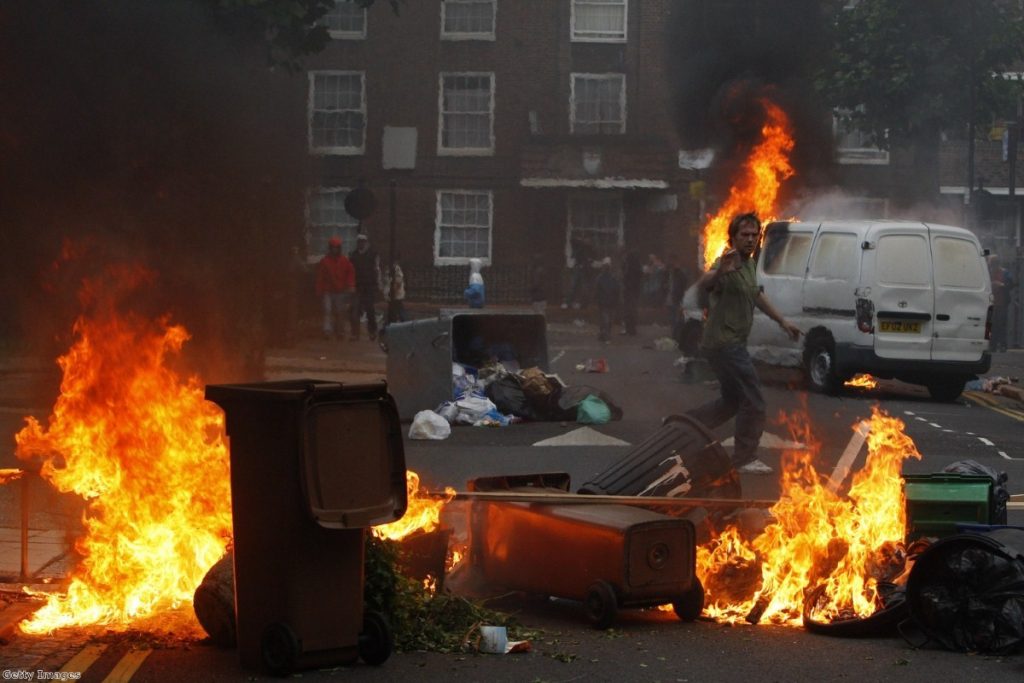 Riots and looting spread from London to cities across England in August 2011