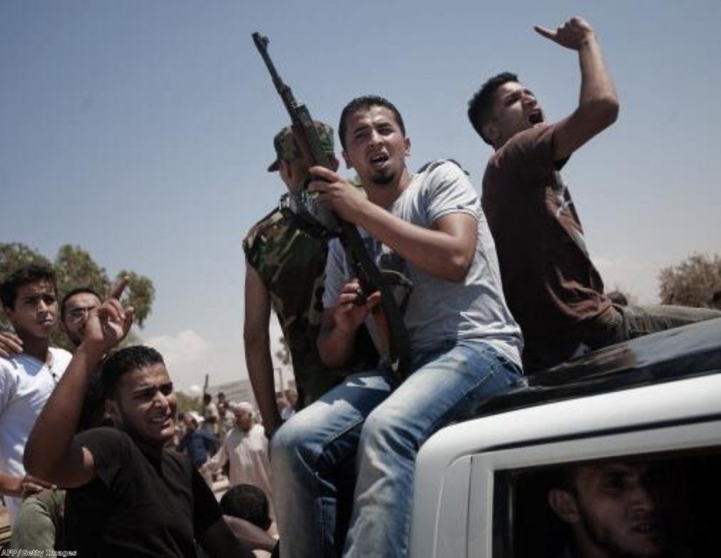 Libyan rebels mourn fallen comrades after securing the oil rich town of Brega earlier this month.