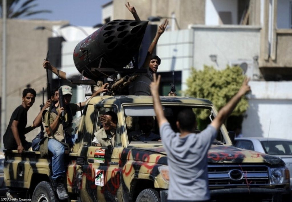 Rebel fighters driver through Tripoli yesterday. Their enthusiasm has failed to boost public support in Britain.