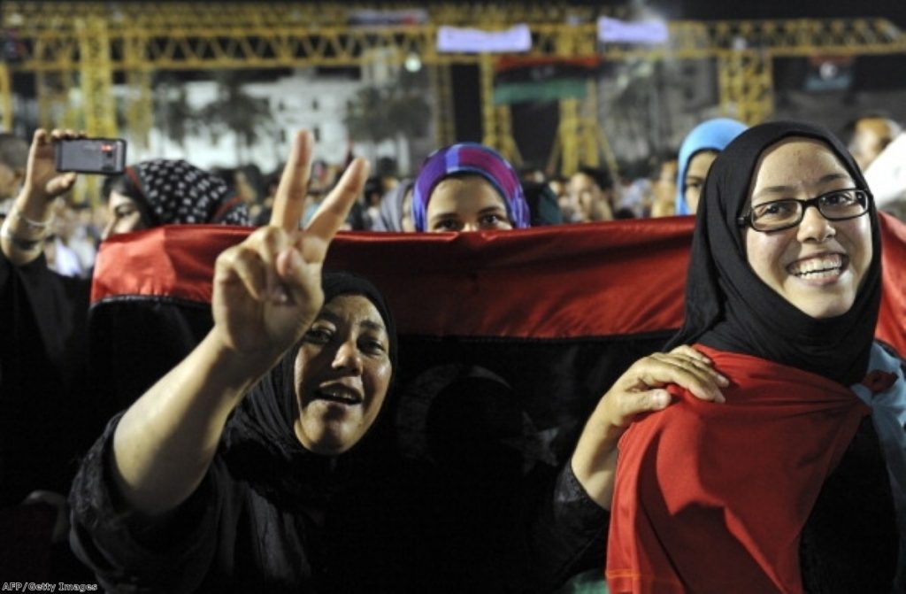 Libyan women celebrate with the new Libyan flag at Martyrs Square in downtown Tripoli last August.