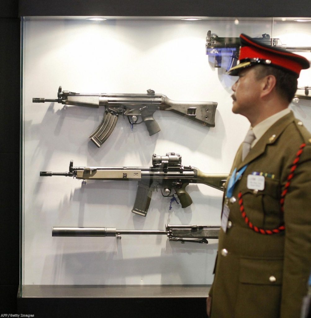 A member of the Chinese military delegation visits the Defence Systems and Equipment International Exhibition (DSEi) in east London, on September 8, 2009.
