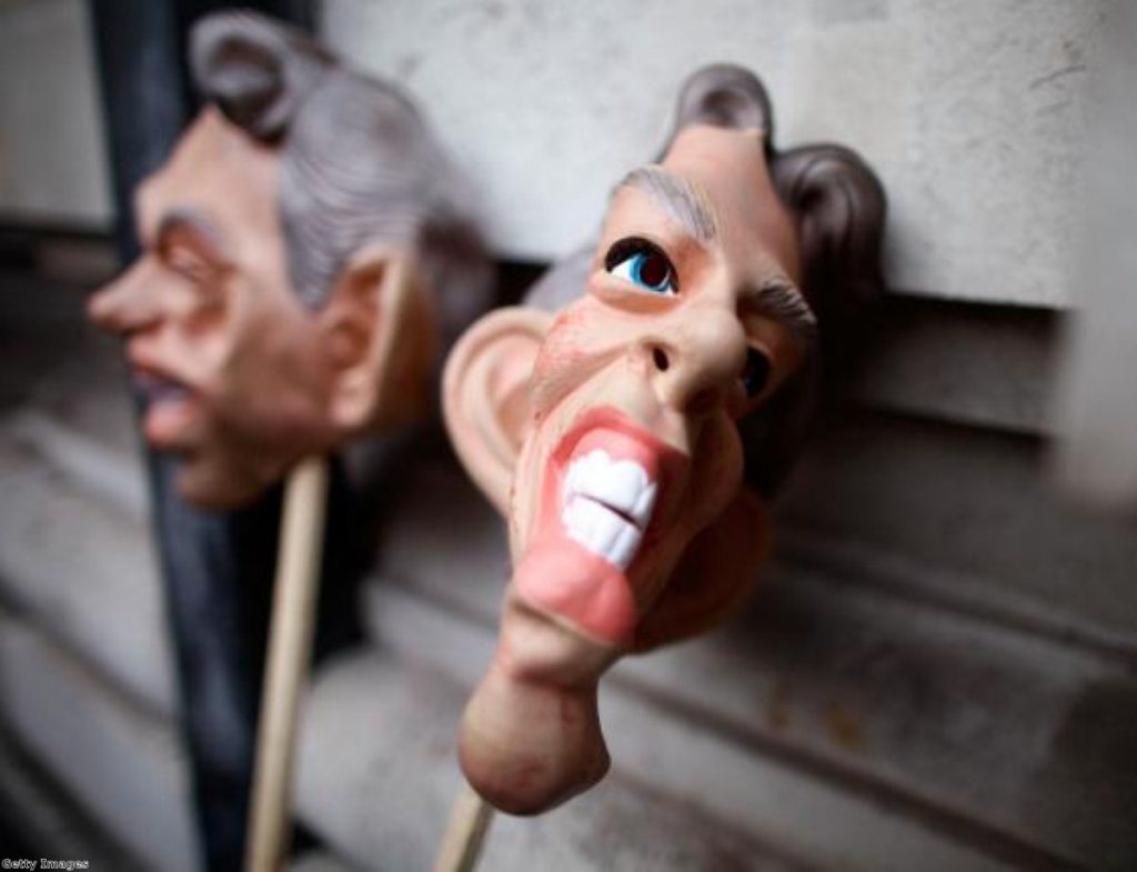 Masks of Tony Blair outside the Iraq inquiry, where the former PM gave evidence. Secret details of his discussions with George Bush are now set to be released