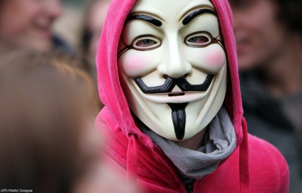 A protester in Frankfurt wears the V-mask, which has become synonymous with the Occupy protests