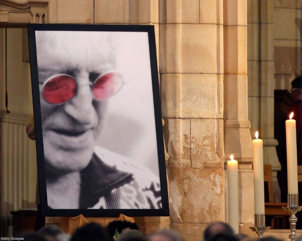 Jimmy Savile looks down at his own funeral in 2011