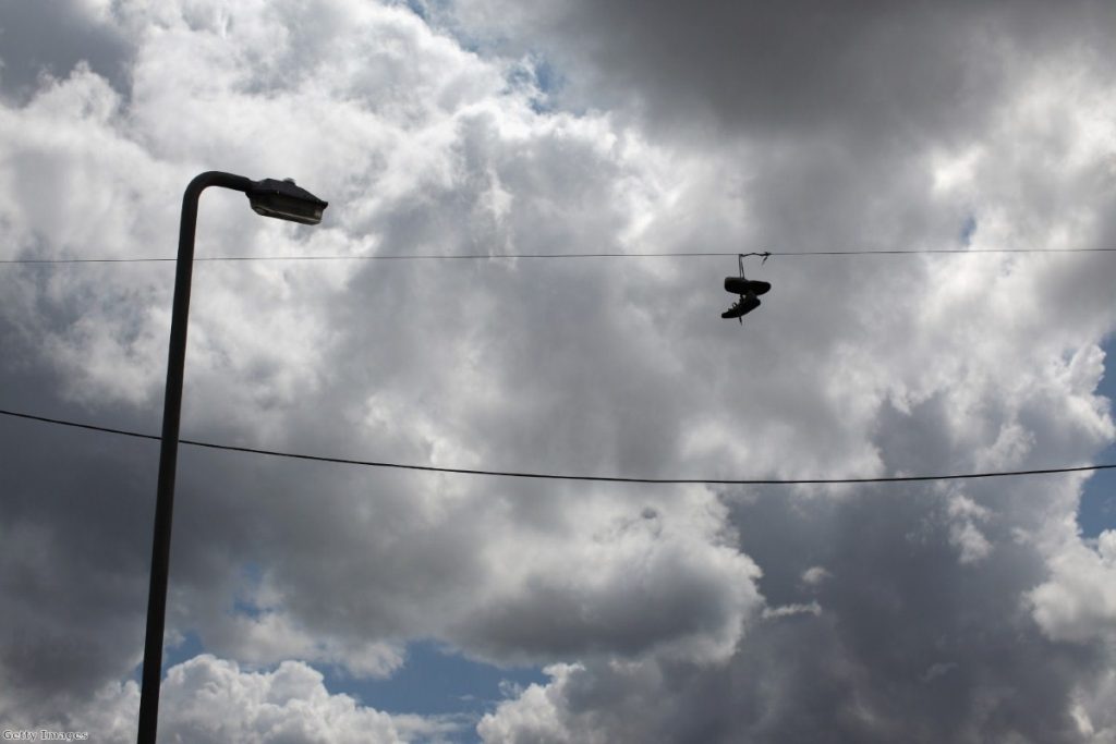 Trainers hang from telephone wires near the corner of Granby Street and Selborne Street where the arrest of Leroy Cooper sparked off the Toxteth riots.