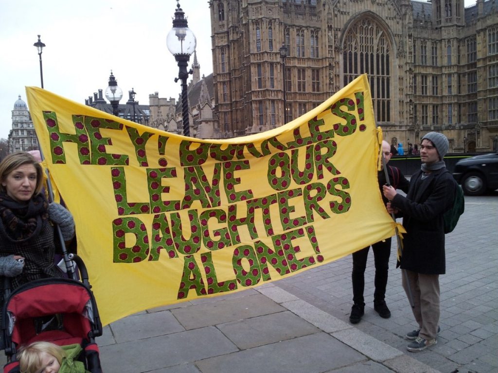 Protesters attend the demo outside parliament today