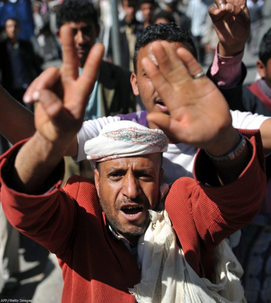 Yemeni protesters shout slogans during a demonstration in Sanaa yesterday in solidarity with the Syrian revolt against President Assad