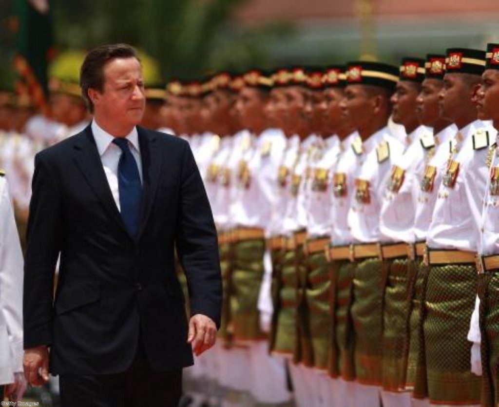 David Cameron inspects a guard of honour in Malaysia