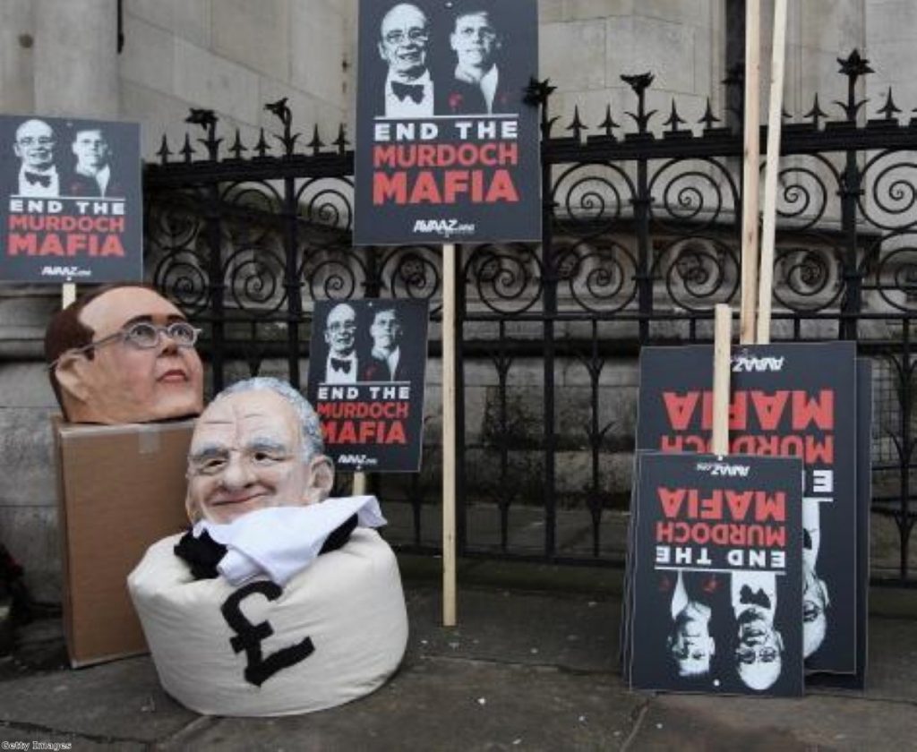 Protesters from the campaign group 'Avaaz' demonstrate outside the high court