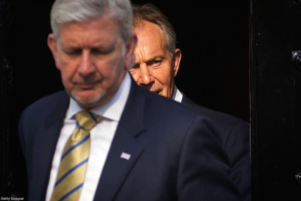 Tony Blair leaves his home with his security detail to go to the Leveson inquiry