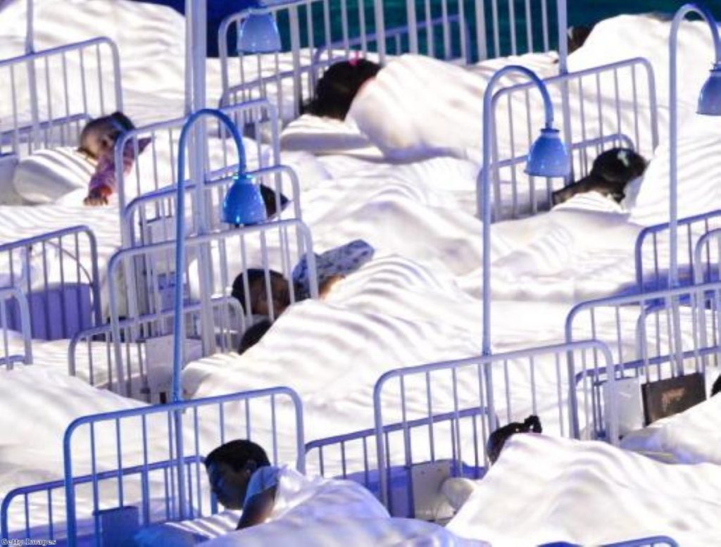 Children take part in the NHS section of the Olympics opening ceremony