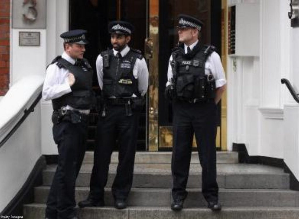 Police officers continue their long wait for Julian Assange outside Ecuador's embassy in London