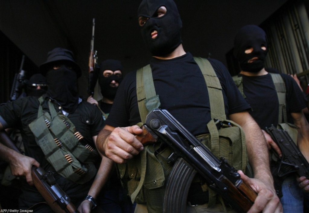 Lebanese masked gunmen from the al-Muqdad clan ready to speak to the press in Beirut's southern suburbs on August 15, 2012. The Muqdads, a large Lebanese Shiite Muslim clan, said it has kidnapped at least 20 Syrians to try to secure the release of a family member abducted near Damascus this week