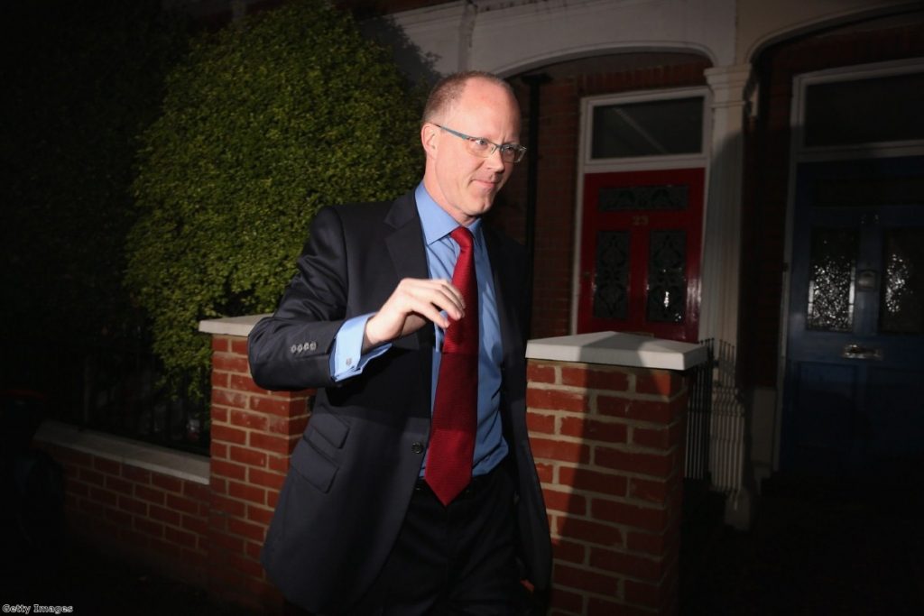 BBC director general George Entwistle leaves his home this morning with a press pack outside his front door.