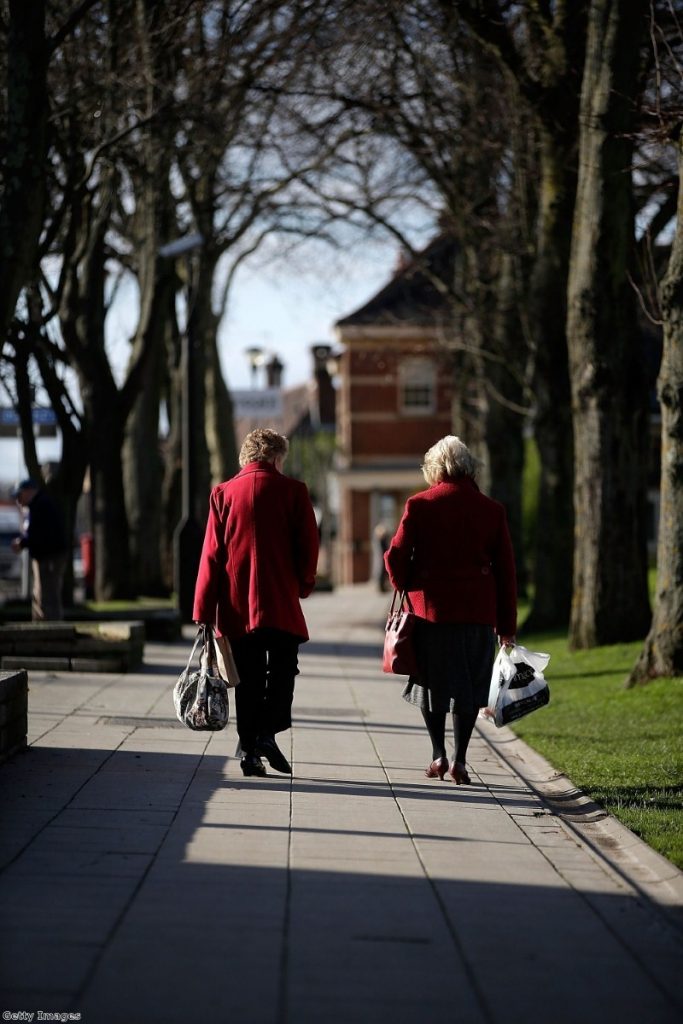Elderly ladies walk in the sunny town centre in Eastleigh as candidates campaign.
