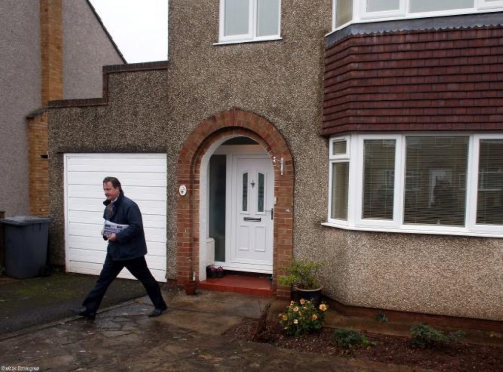 Back to the grassroots: David Cameron on the doorstep. He insisted he was a 'volunteer' in the Conservative party