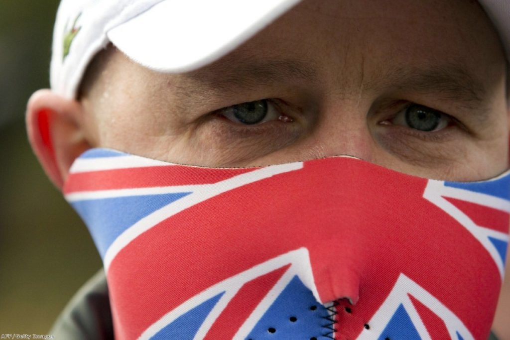 An EDL supporter at a rally. The organisation may not survive without Robinson as its figurehead.