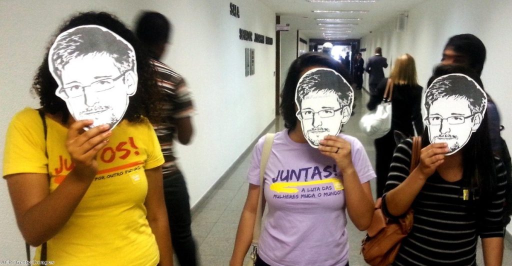 Members of the Youngs Together activist group pose with masks of Edward Snowden during a public hearing of Brazil-based Guardian reporter Glenn Greenwald at the Brazilian Senate's foreign relations committee earlier this month.
