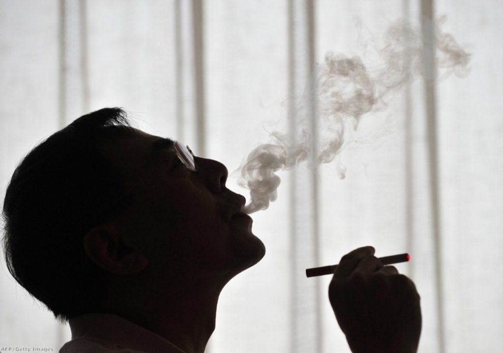The inventor of the electronic cigarette, Hon Lik, smoking his invention in Beiijng in 2009.