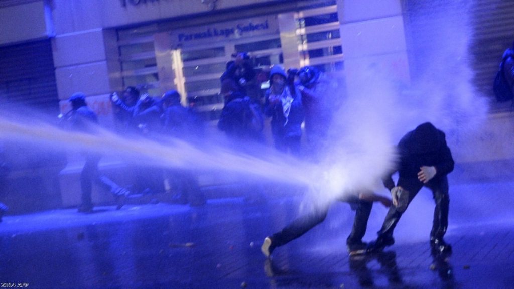 Police fire water cannon at anti-government protesters in Turkey.