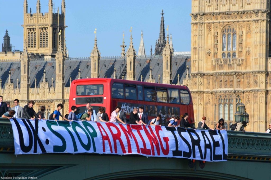 A 75-foot banner is unfurled along Westminster Bridge