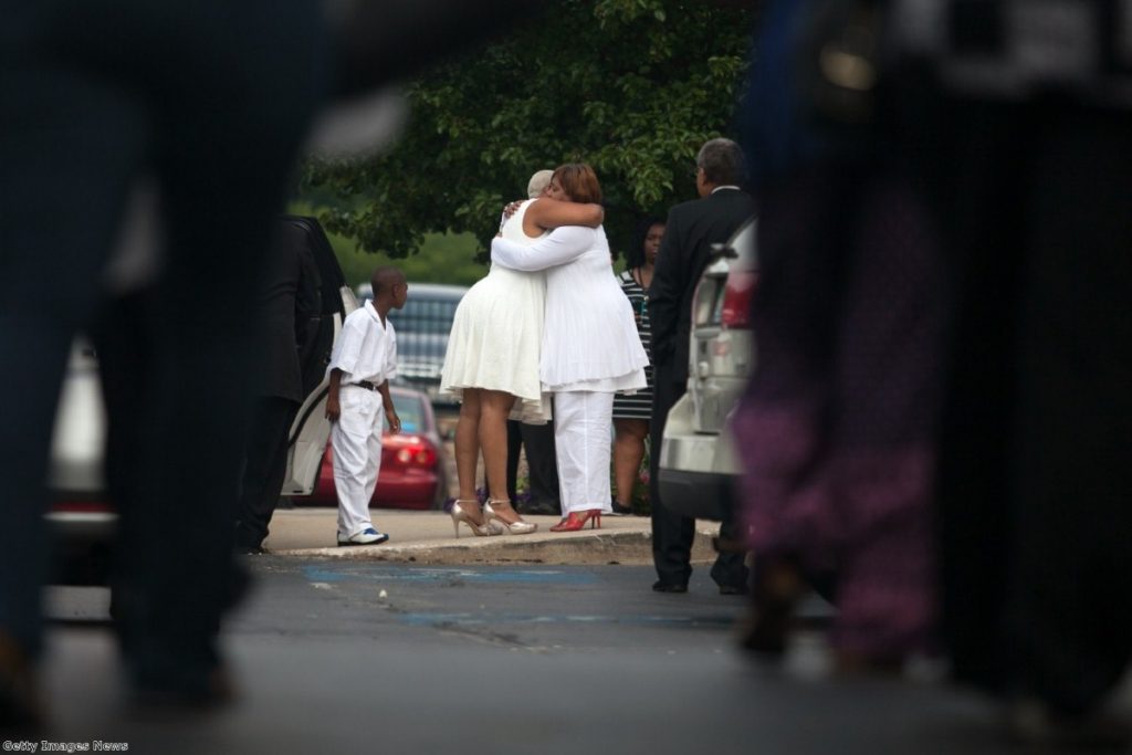 Sandra Bland's sister, Shavon, is embraced before her funeral service at DuPage African Methodist Episcopal Church in Illinois last Saturday