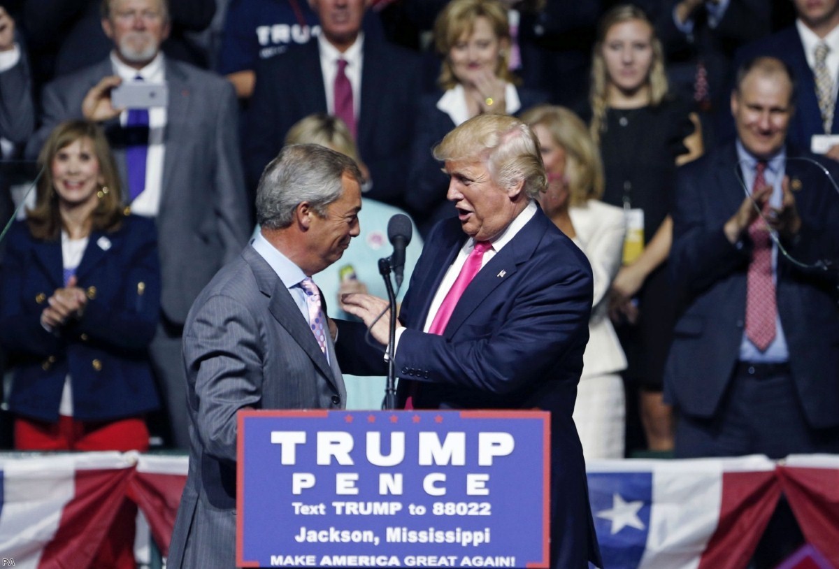 Donald Trump greets Nigel Farage to the stage in Mississippi