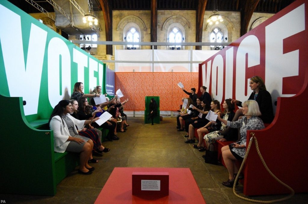 Visitors take part in a 'Parliamentary debate', during a preview of Voice & Vote: Women's Place in Parliament | Copyright: PA