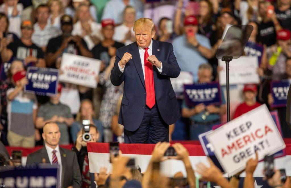 President Donald Trump works the crowd during a campaign rally at East Carolina University, where chants of 'send her back' broke out.