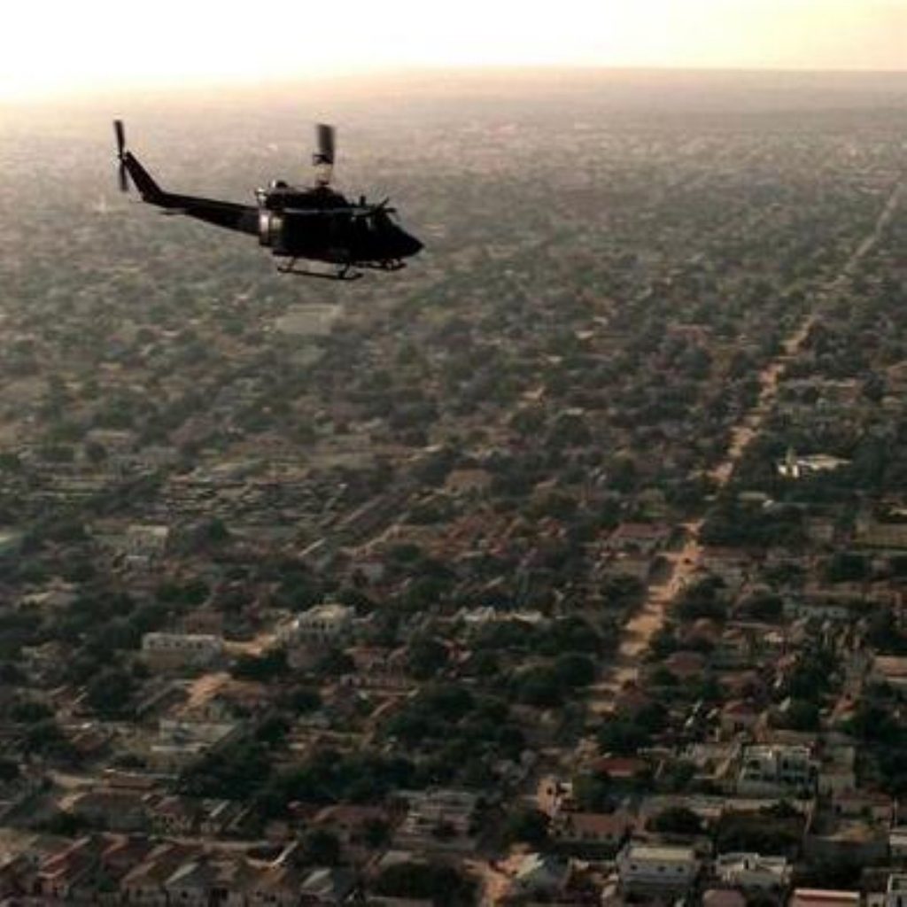 A helicopter flies over Mogadishu, Somalia