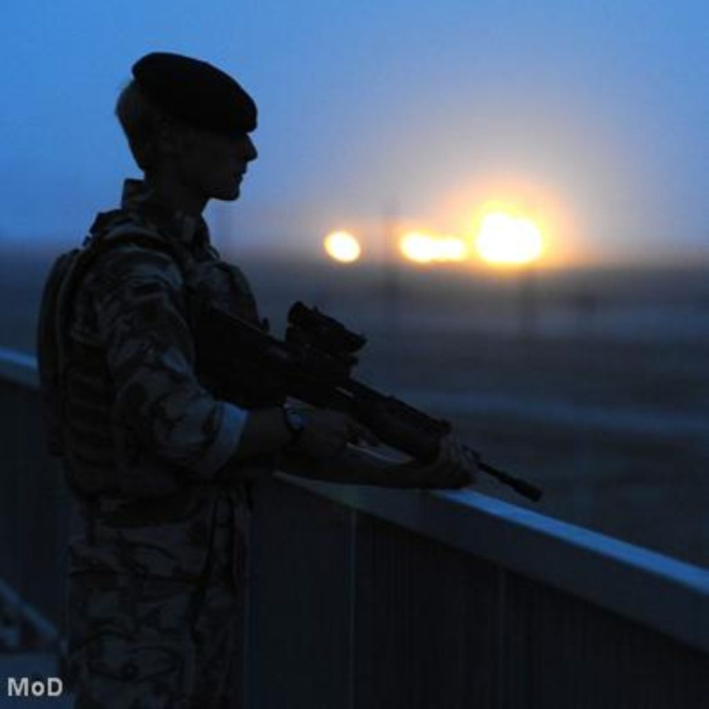 A British troop stands watch in Iraq