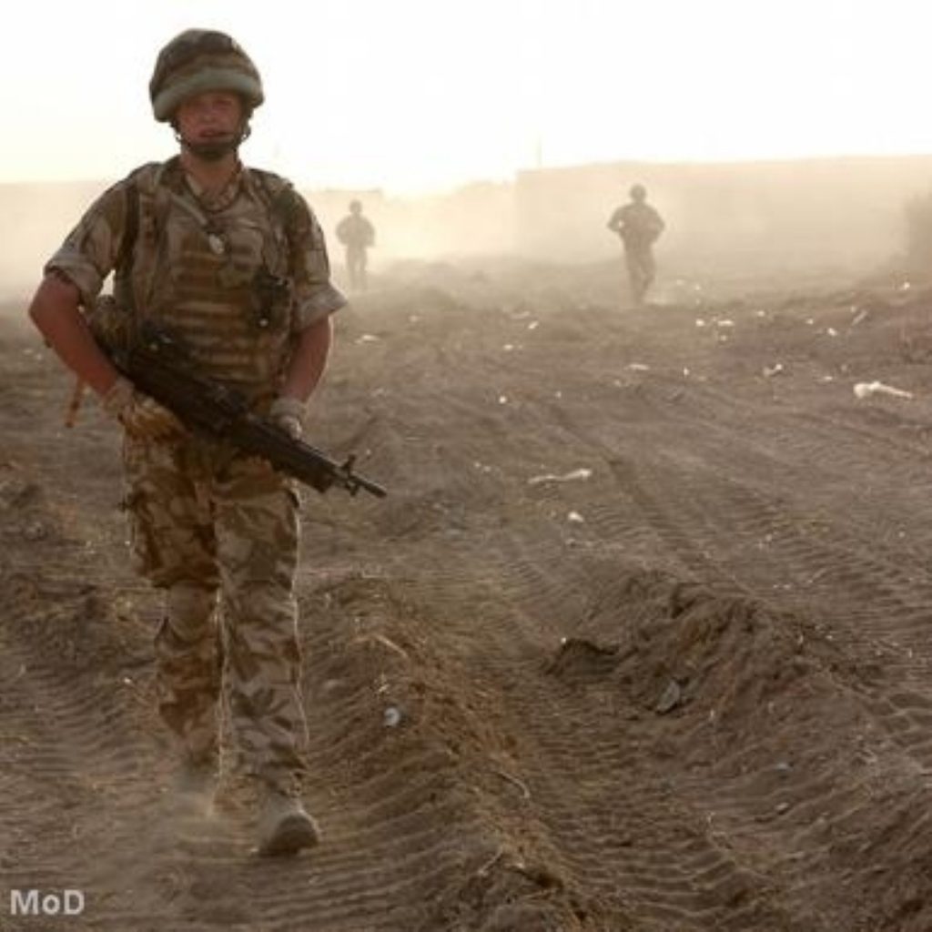 A British soldier patrols in Afghanistan