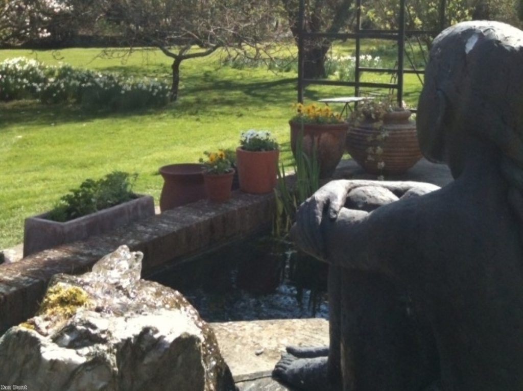 A statue looks over a garden in Hampshire, near Romsey