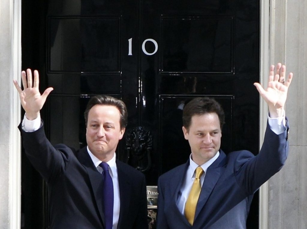 David Cameron and Nick Clegg enter Downing Street together this morning